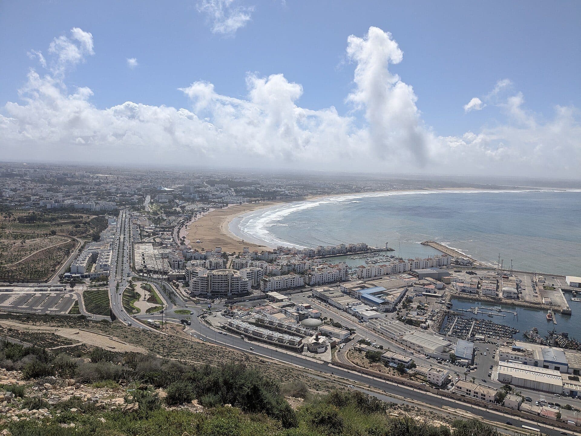 The bay of Agadir with its long beach, the marina and the city, seen from the kasbah hill