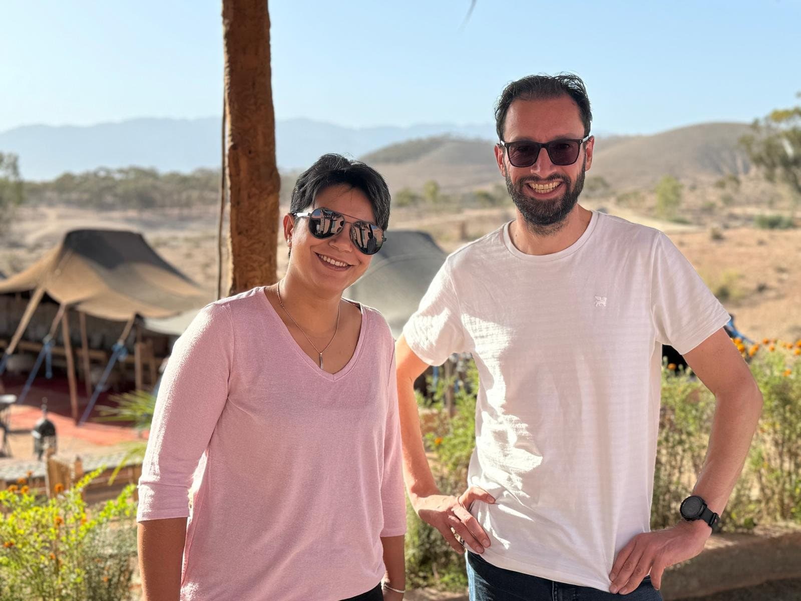 Soukayna and Bas at a tented camp in the desert near Marrakesh, with the Atlas in the background