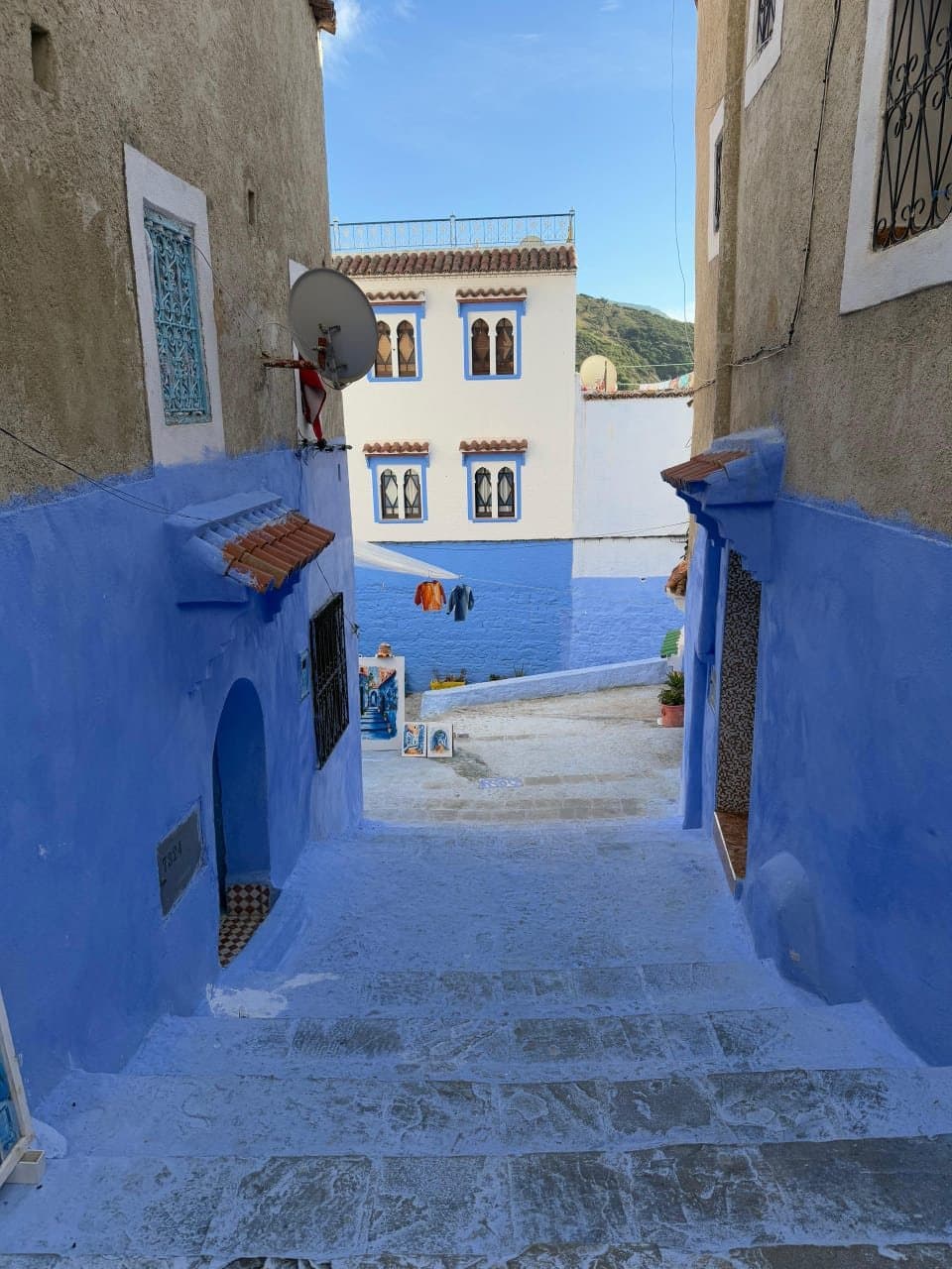 A narrow blue alley with steps in the medina of Chefchaouen