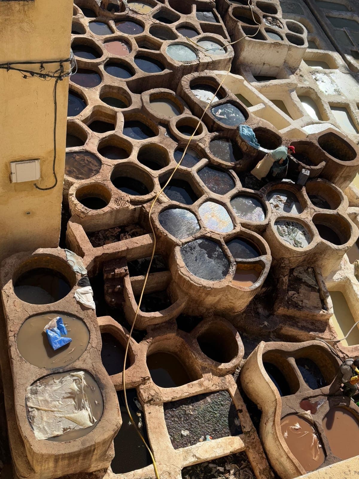 The round dye pits of a tannery in the medina of Fes